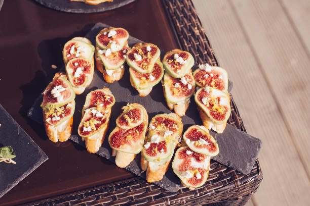 istock Catering banquet table with different food snacks and appetizers 869122144