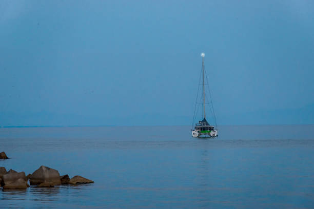 Yacht - catamaran in the evening bay
