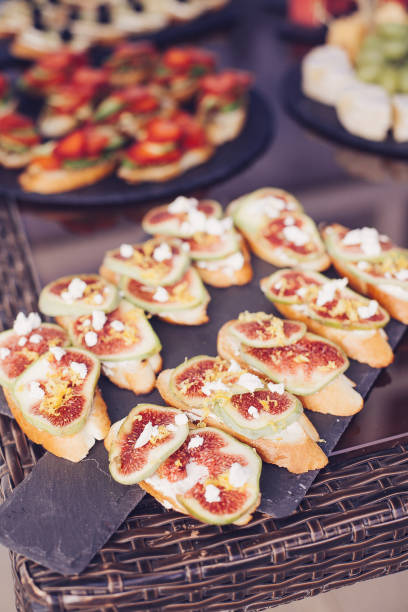 istock Catering banquet table with different food snacks and appetizers 869122482