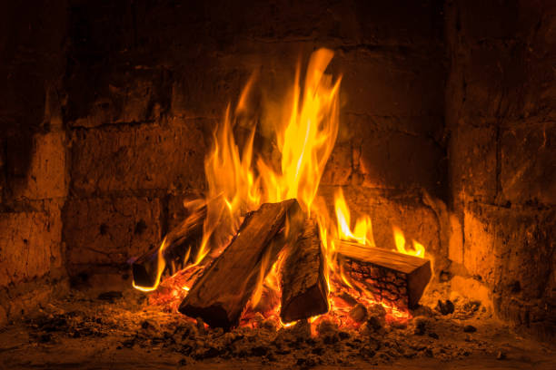 istock A fire burns in a fireplace, Fire to keep warm 869125262