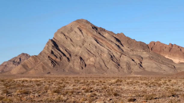Distorted and tilted rock formations in the Great Basin near Pahrump Nevada close to the eastern entrance to Death Valley National Park Nevada