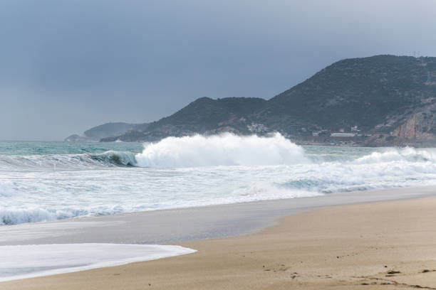 Large waves hitting the shore at Cleopatra beach of Alanya - Mediterranean coastal town in Turkey