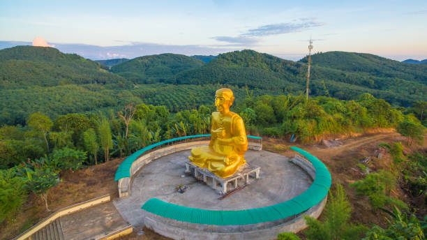 istock Golden big Buddha beside hight way 869132000