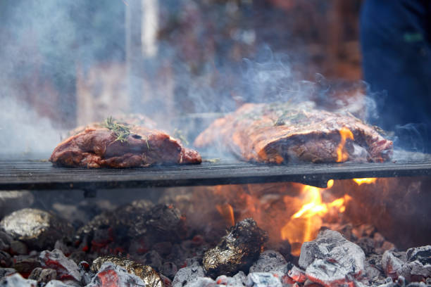istock Steaks fry on a grid with seasonings and herbs on them 869138584