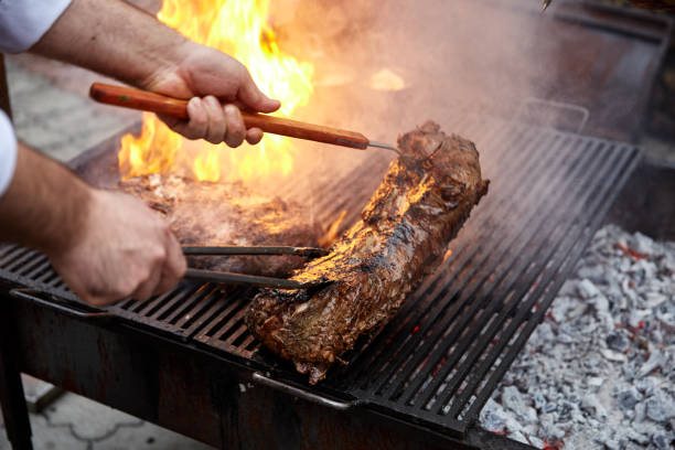istock Steaks fry on a grid with seasonings and herbs on them 869139114