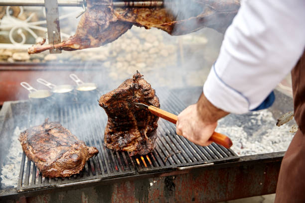 istock Steaks fry on a grid with seasonings and herbs on them 869139394