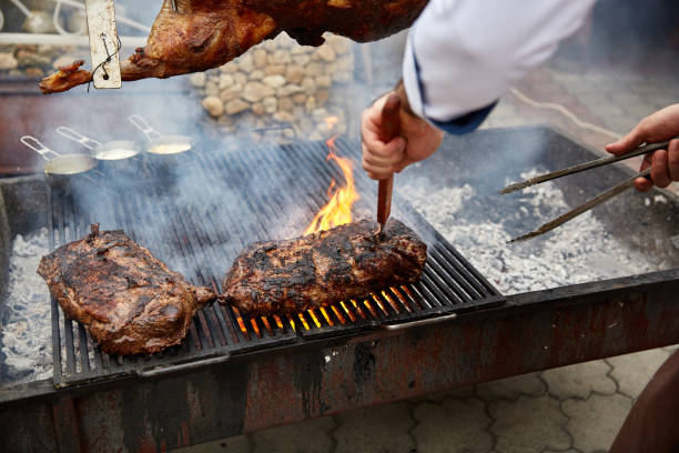 istock Steaks fry on a grid with seasonings and herbs on them 869139542