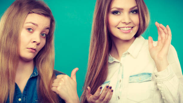 Comparison of girls with and without make up. Look results of using cosmetics. Portrait of two girls one with and second without make up. Comparison of natural and cosmetical beauty of women. ugly makeup stock pictures, royalty-free photos & images