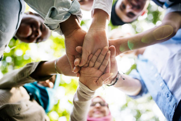 istock Group of diverse youth hands joined 869170712