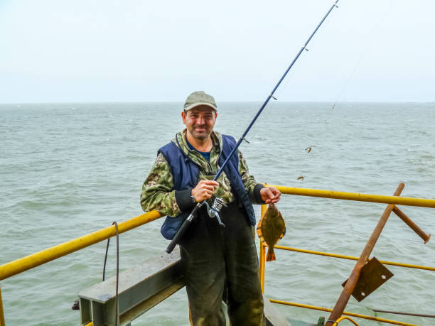 istock Flounder on the deck. Fishing on the boat. Bottom fish 869171838