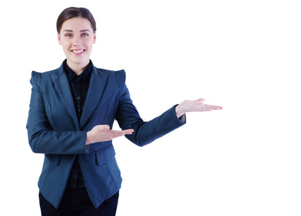 istock smiling business woman  presenting product isolated on white. 869174190