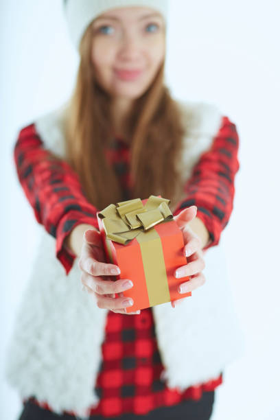 istock Portrait happy woman with gift box in hands. 869174692