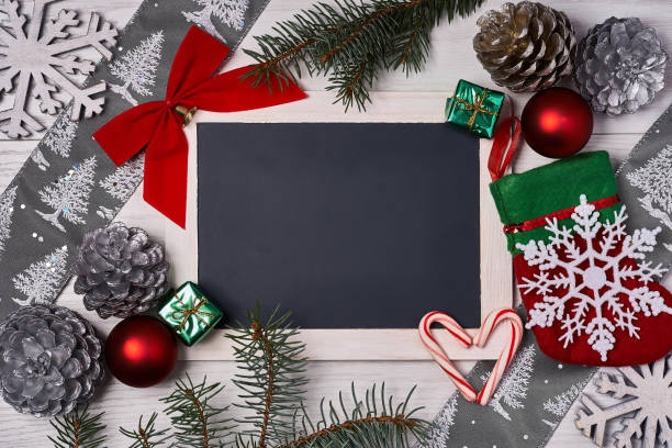 istock Christmas background with decorations and ornaments on wooden board 869174820