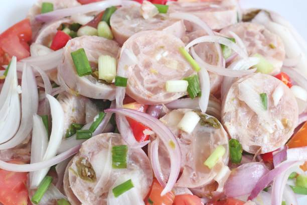 istock Thai Cuisine : Spicy Thai Sour Sausage with salad 869184828