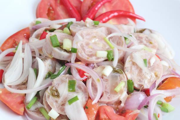istock Thai Cuisine : Spicy Thai Sour Sausage with salad 869184886