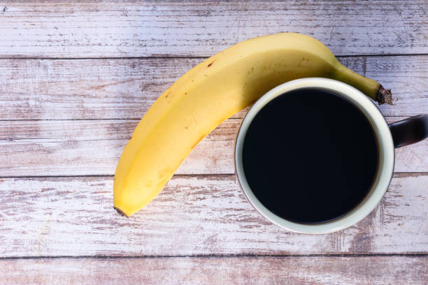 Coffee and banana on table