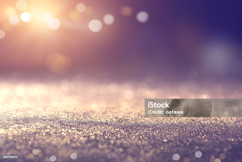 Gold and blue glitter lights bokeh abstract background holiday. defocused. Backgrounds Stock Photo