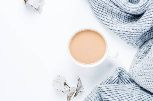coffee with milk and a gray scarf on a white background. the concept of autumn - 5943 imagens e fotografias de stock