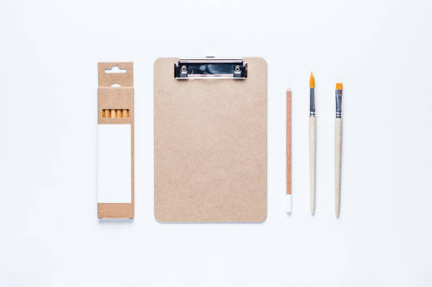 istock Clipboard, pencils and brushes on white background 869202096