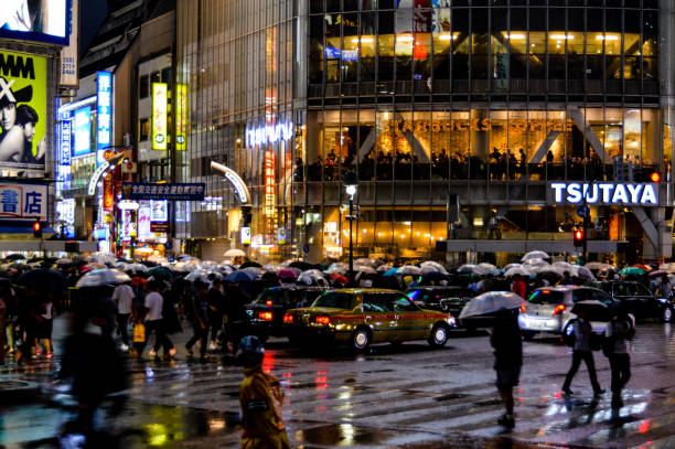 istock Tokyo Shibuya Crossing at night during rain 869202300