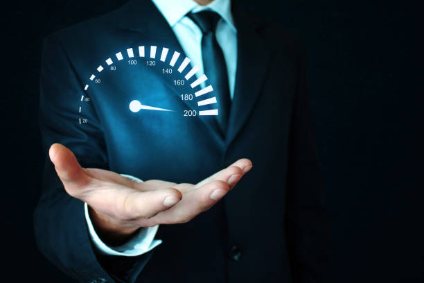 istock Man holding car speedometer. Speed concept. 869206566