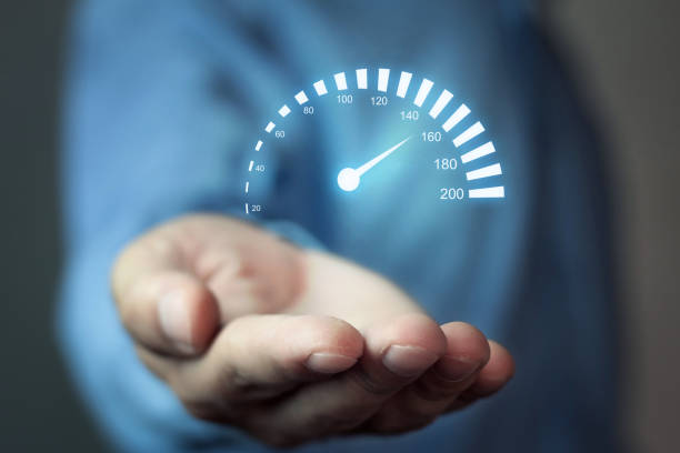 istock Man holding car speedometer. Speed concept. 869206590