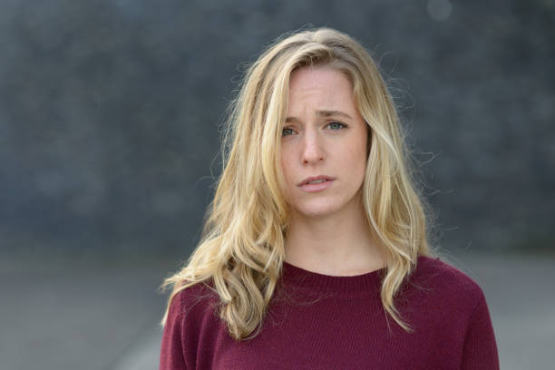 istock Upset young woman with a sad expression 869210548