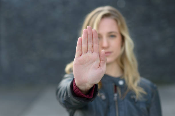istock Young woman making a halt gesture 869214858