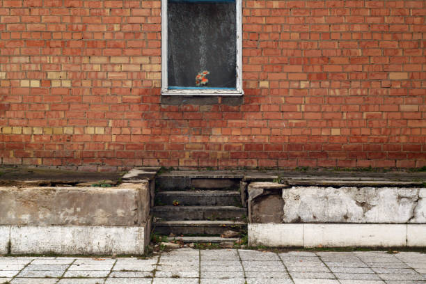 istock Old window and brick wall with stairway. 869222514