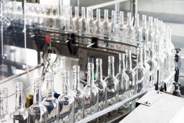 istock Empty glass bottles on the conveyor 869226172