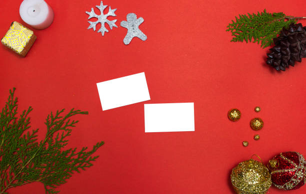 istock Computer laptop mobile display on table with isolated white screen for mockup in Christmas time. Christmas tree, gifts, decorations in background. 869226218
