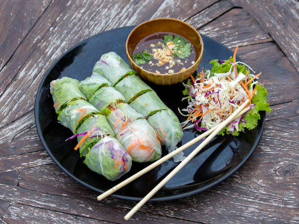 istock Fresh vietnamese spring rolls on a plate with salad 869226682