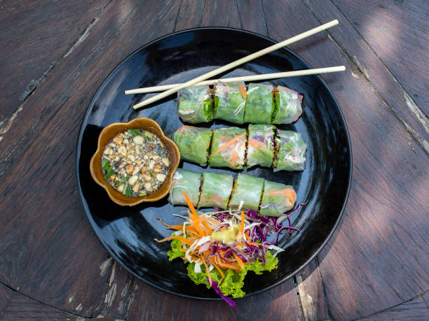istock Fresh vietnamese spring rolls on a plate with salad 869227758