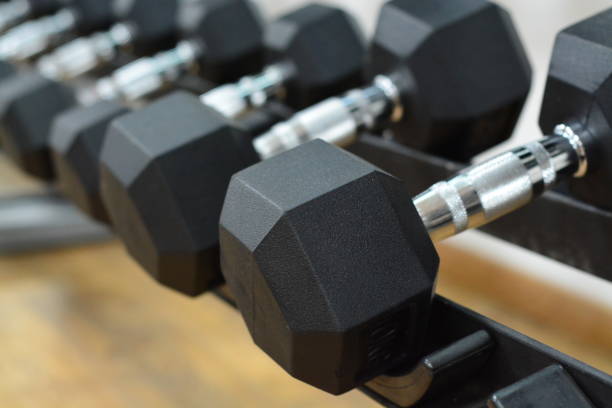 istock Row of Dumbbells on a rack 869230236