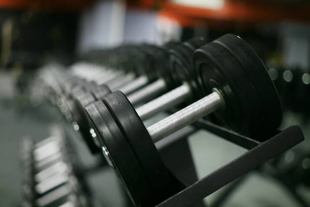 istock Rows of dumbbells on a rack 869230586