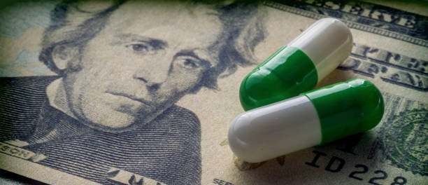 capsules up ticket dollar, concept of health copay stock photo