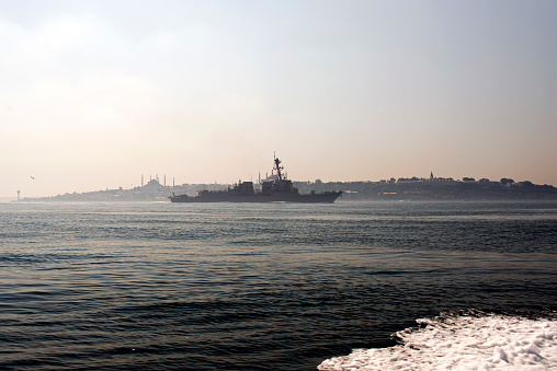 A skyline of Istanbul and a warship in the sea of Marmara