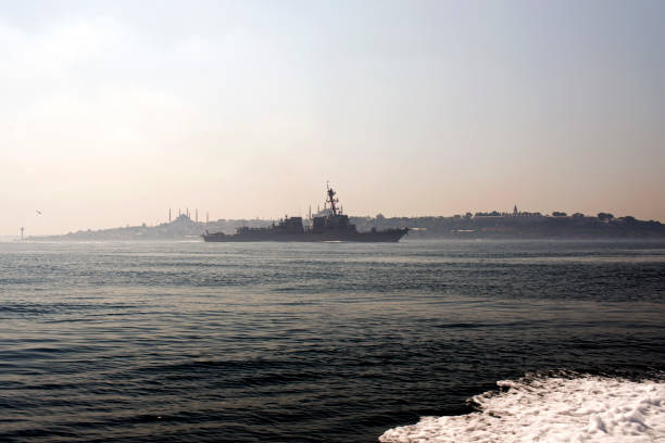 a skyline of istanbul and a warship in the sea of marmara - sillhoutte imagens e fotografias de stock