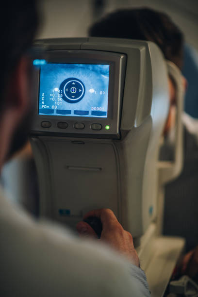 istock Human eye on a display of a diagnostic medical tool during eyesight exam. 869235482