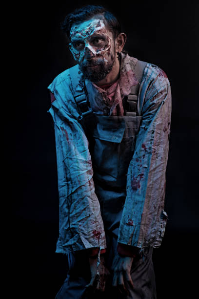 istock Male Zombie Alone wearing ruined clothes 869237764