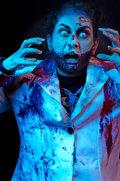 istock Female Zombie white eyed nurse with slashed neck 869238556
