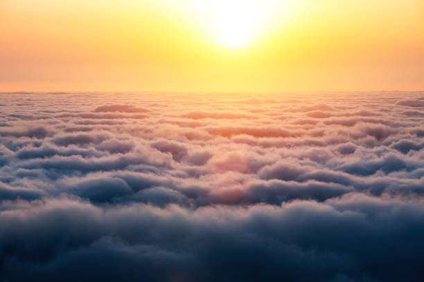 Sunrise Above The Clouds Colorful sunrise above the clouds (Madeira island, Portugal). sun above clouds stock pictures, royalty-free photos & images
