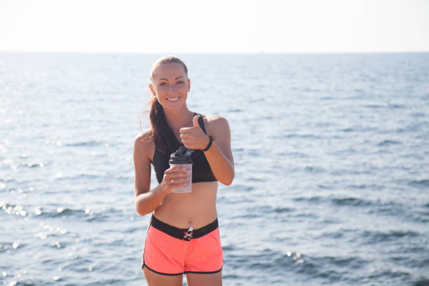 istock girl drinks water after sports 869242914