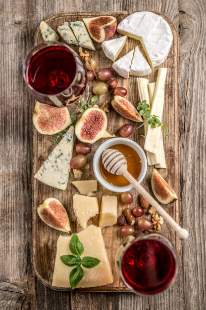 istock Cheese plate served with wine, nuts and honey 869243392