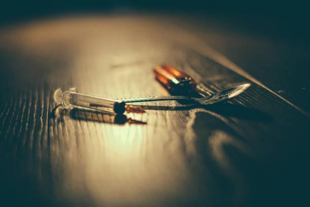 Ready to do drugs Drug abuse gear, syringe, spoon and lighter on the floor, no people. self harm photos stock pictures, royalty-free photos & images