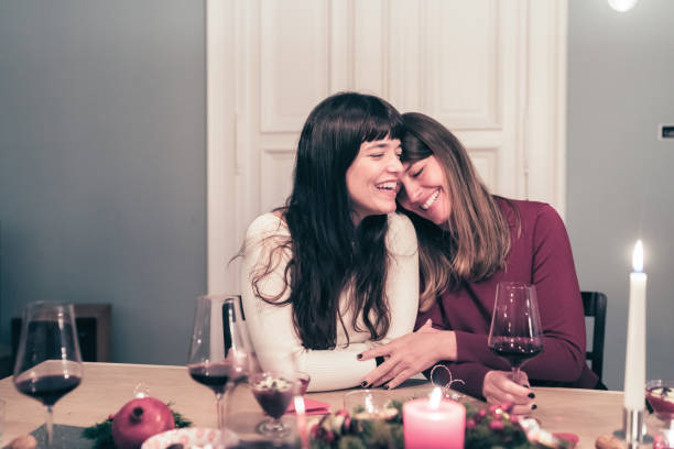 istock young beautiful sibling sisters close together at christmas table 869251304