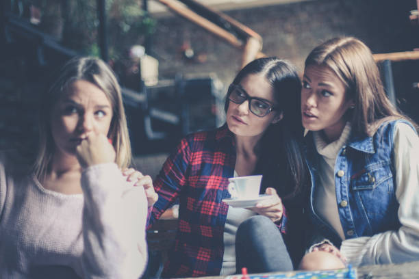 istock Girls playing board game and having serious conversation. . Close up. 869257524