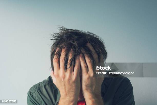 Disappointed Man Crying With Head In Hands Stock Photo - Download Image Now - Emotional Stress, Head In Hands, Men