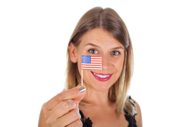 istock Woman holding USA flag 869258082