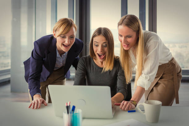 istock Three business women in modern office working on the project together. 869258274